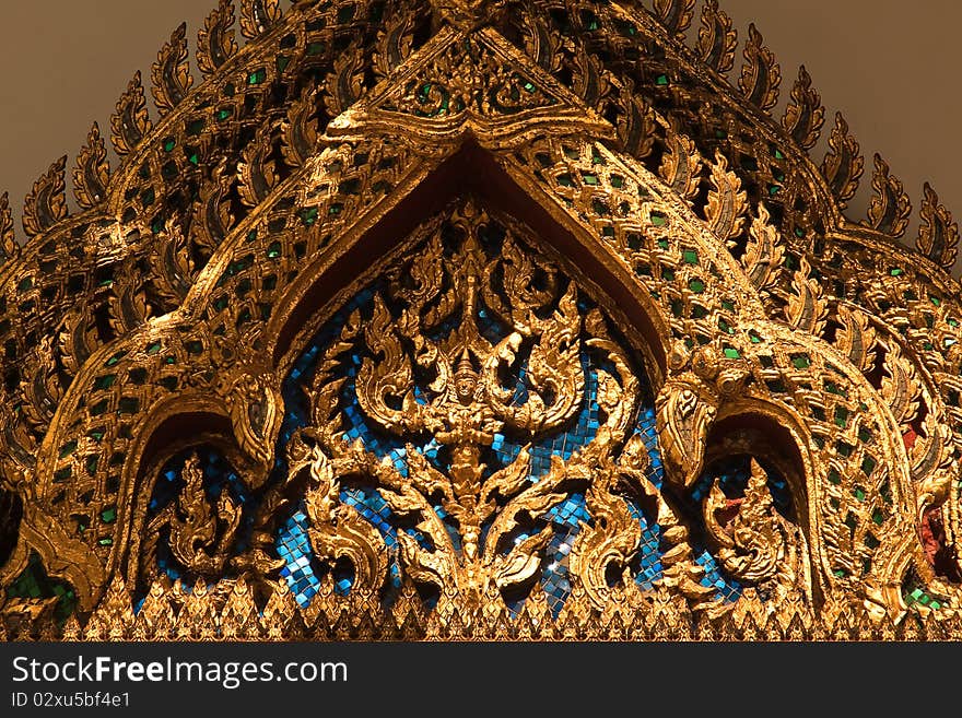 Buddhist angel at the triangular end of the temple roof. Buddhist angel at the triangular end of the temple roof