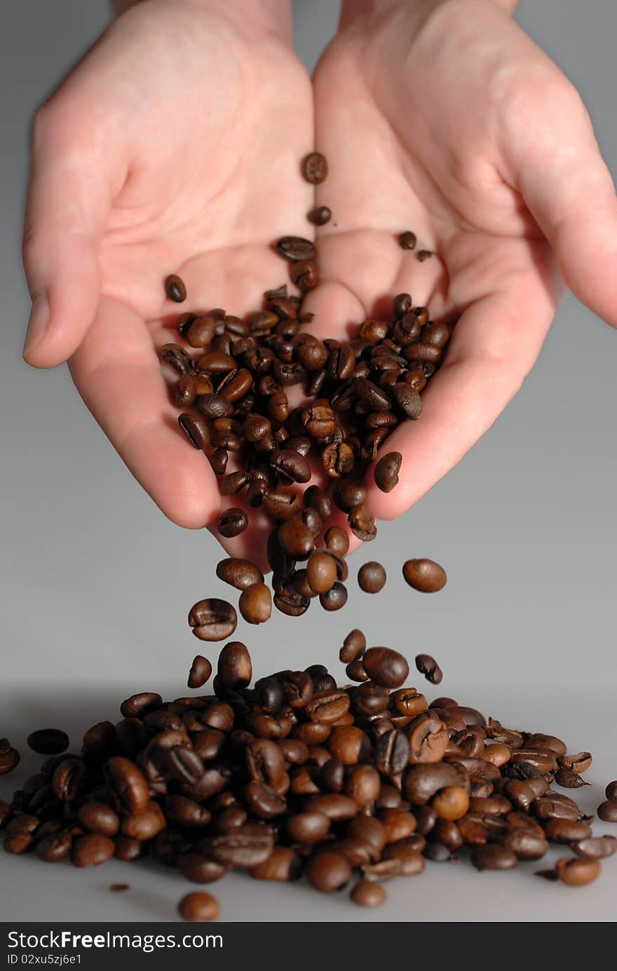 Coffee is poured from the open palm