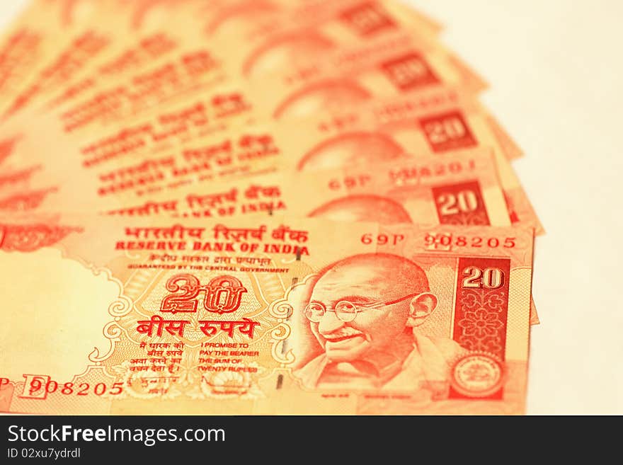 Indian twenty rupee bills arranged in a fan. Indian twenty rupee bills arranged in a fan