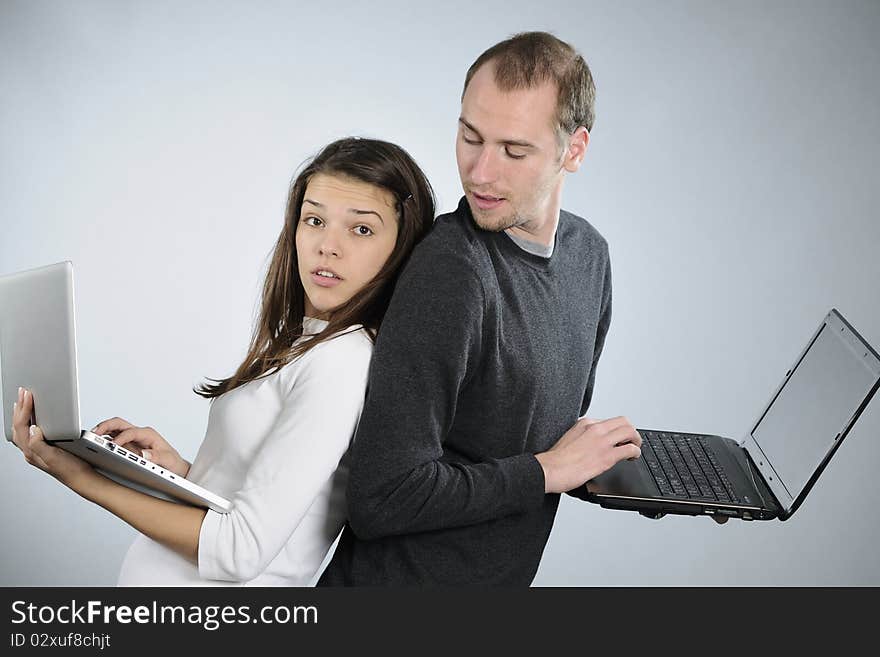 White man trying to steal information from his young colleague. White man trying to steal information from his young colleague