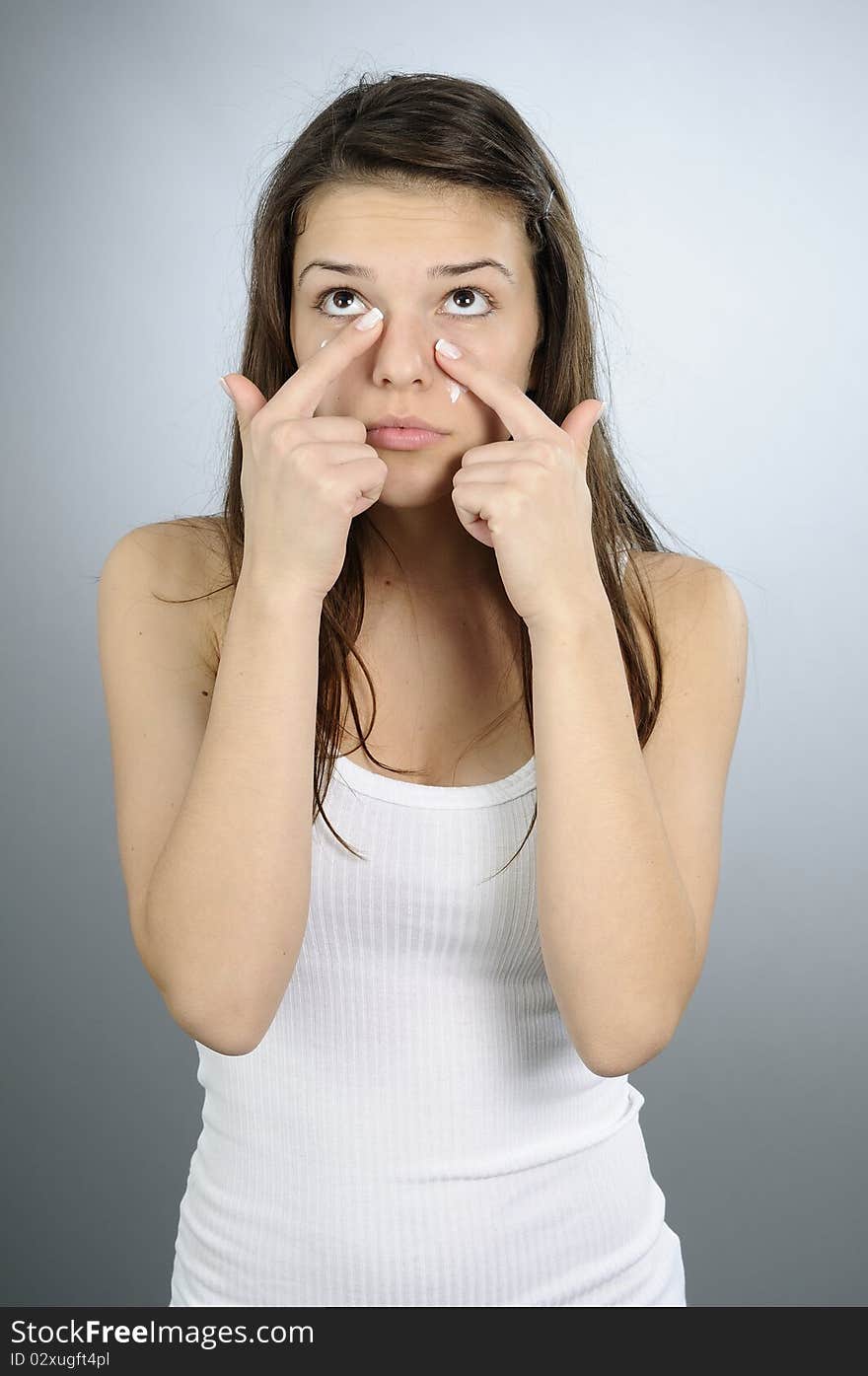 Woman Applying Moisturizer