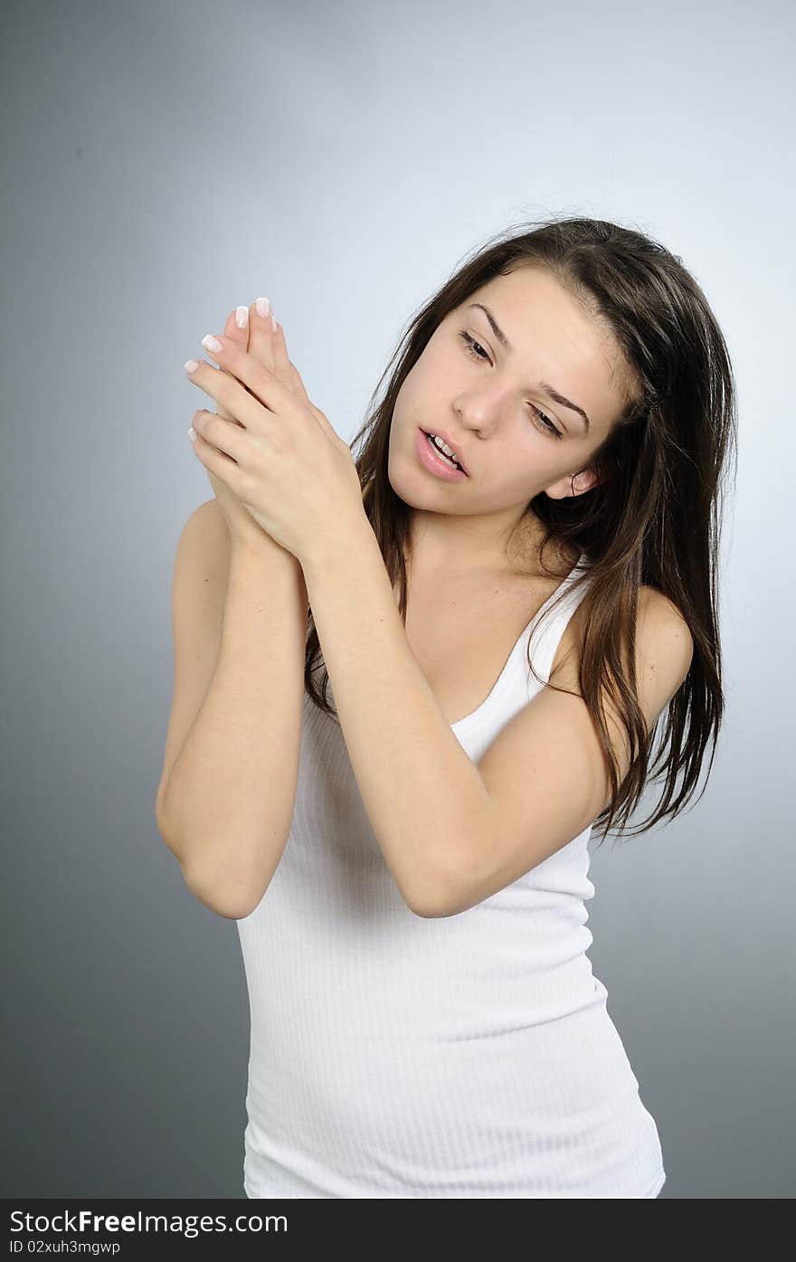 White adult treating her hands. White adult treating her hands