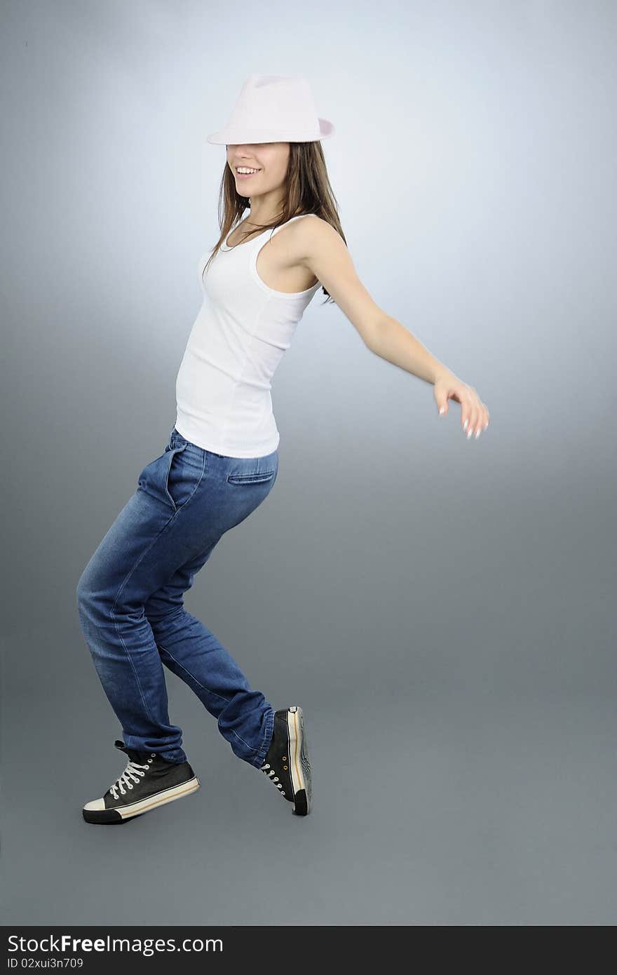 Beautiful girl jumping in studio