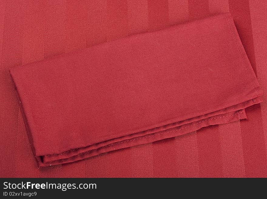 Table napkins of cloth on a red background.