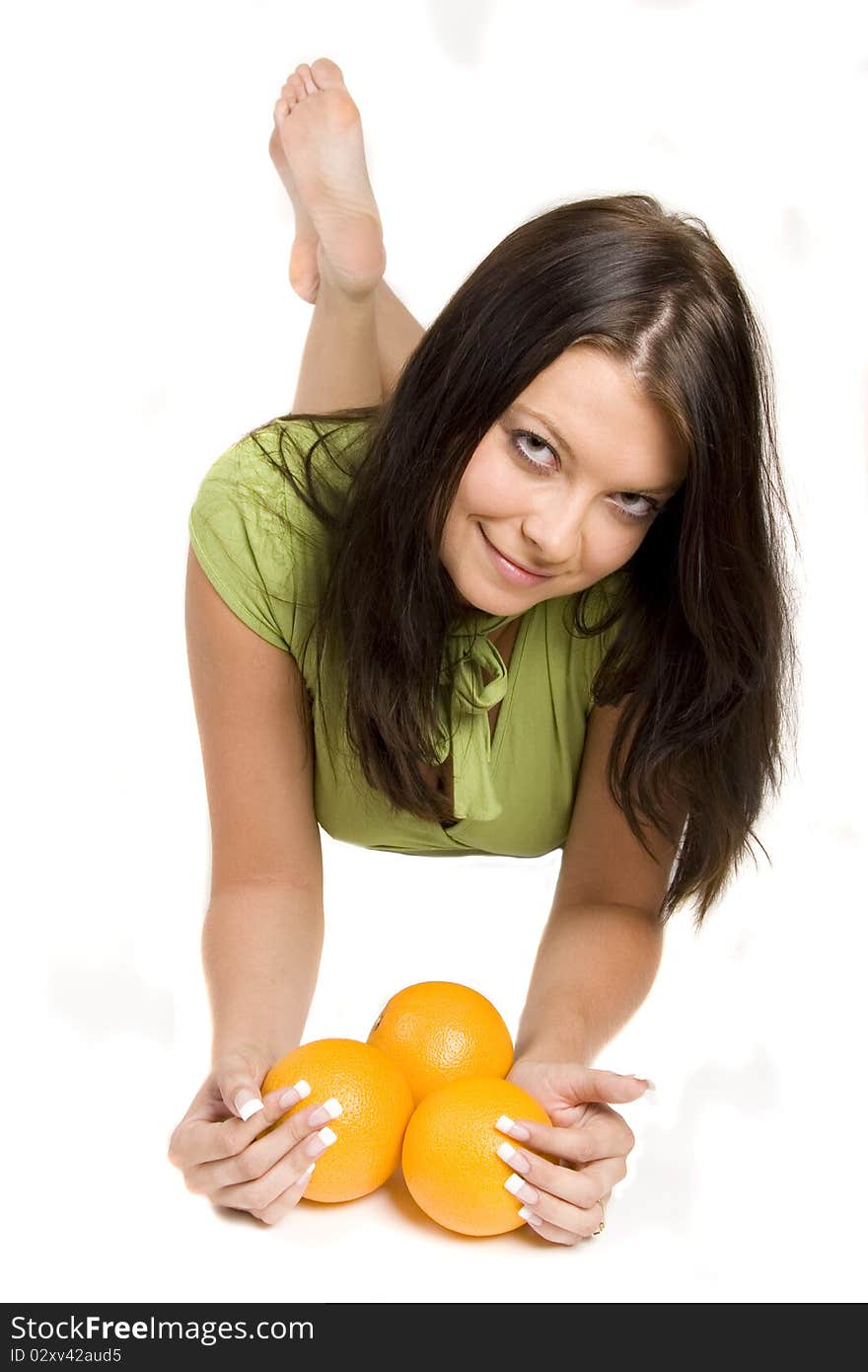 Young girl with citrus fruits on white background