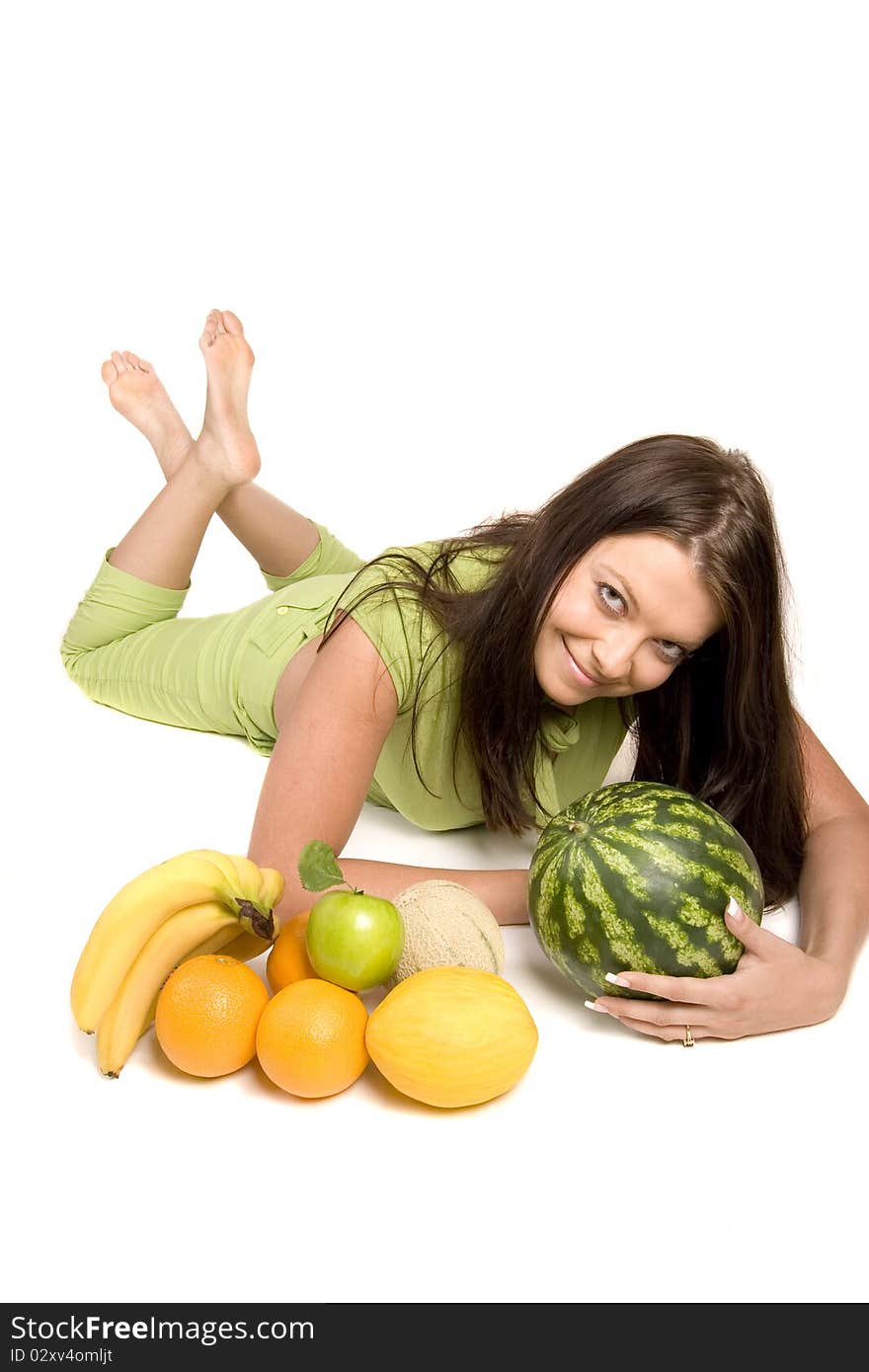 Young girl with citrus fruits on white background