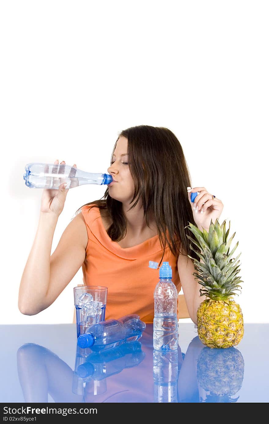 Young girl with citrus fruits and water on white background. Young girl with citrus fruits and water on white background