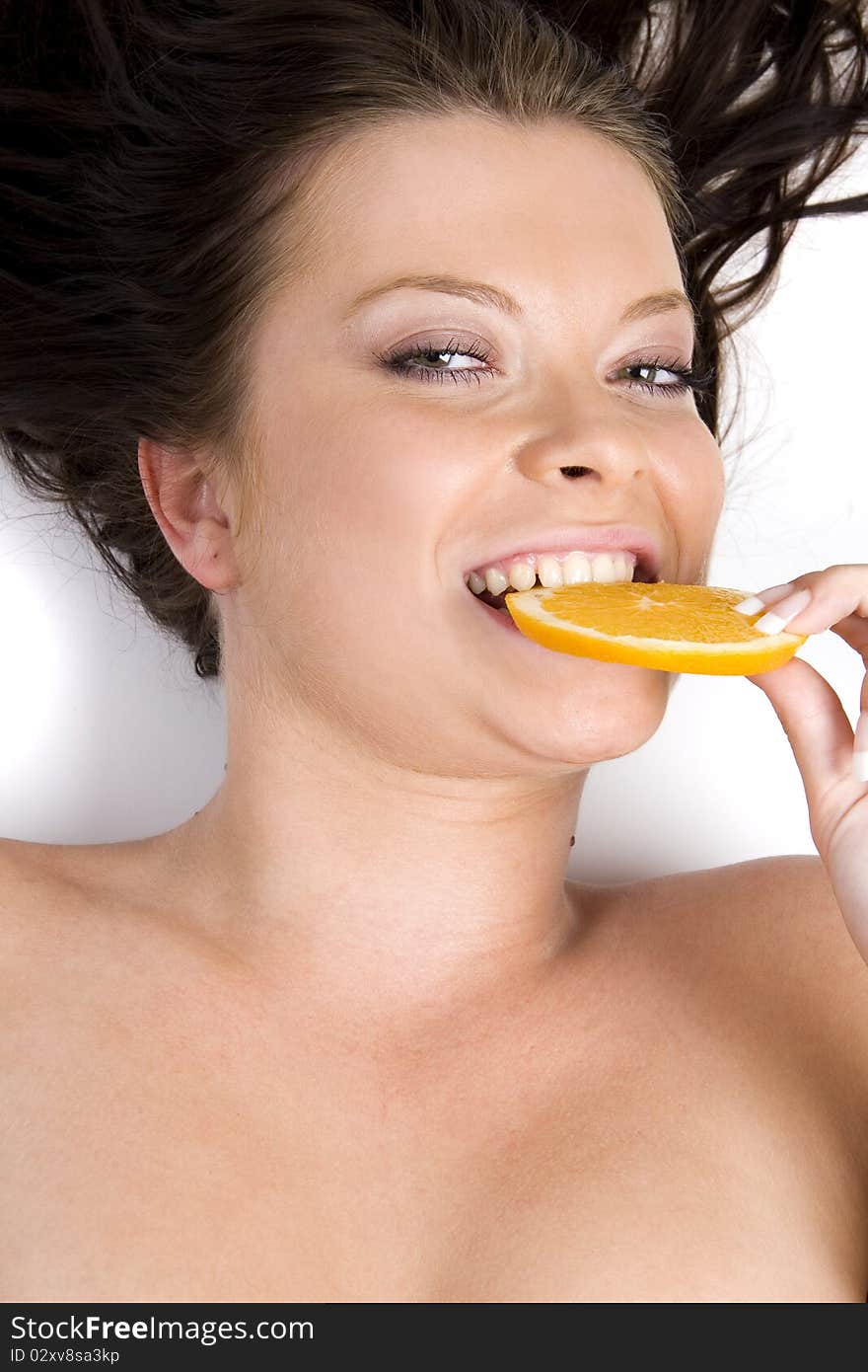 Young girl with citrus fruits on white background. Young girl with citrus fruits on white background