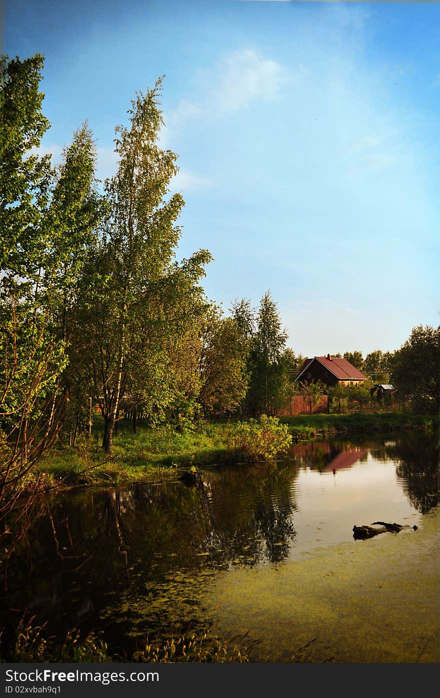 Russia. Summer,A landscape of forest, lake and a little house. Russia. Summer,A landscape of forest, lake and a little house