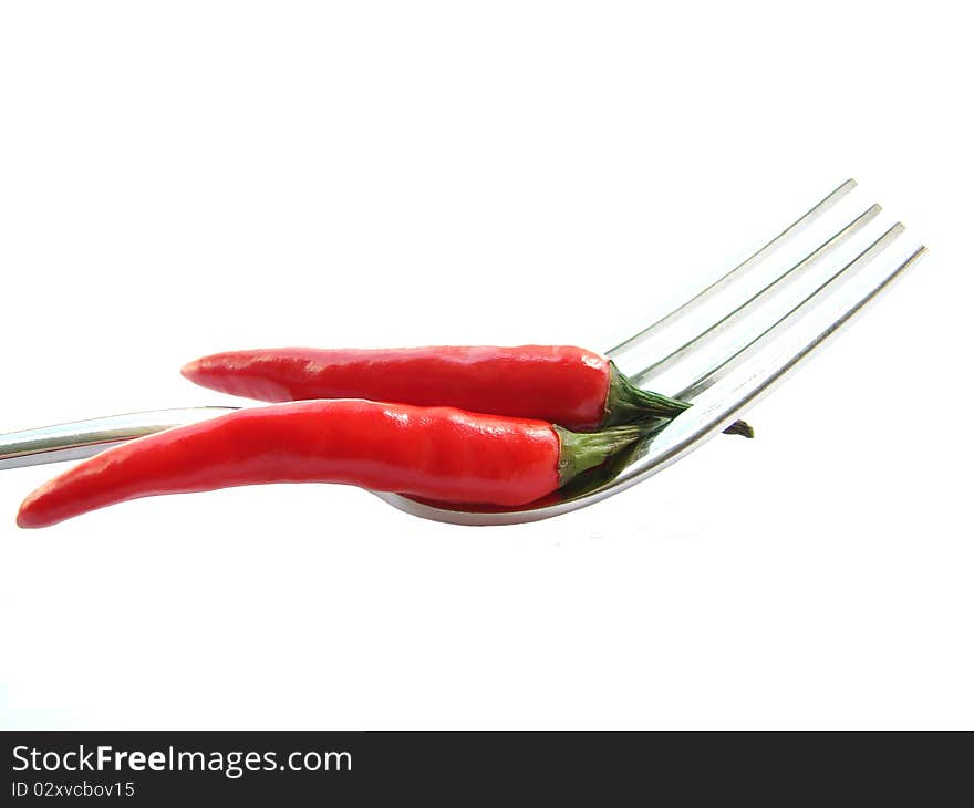 Red chili peppers on the fork