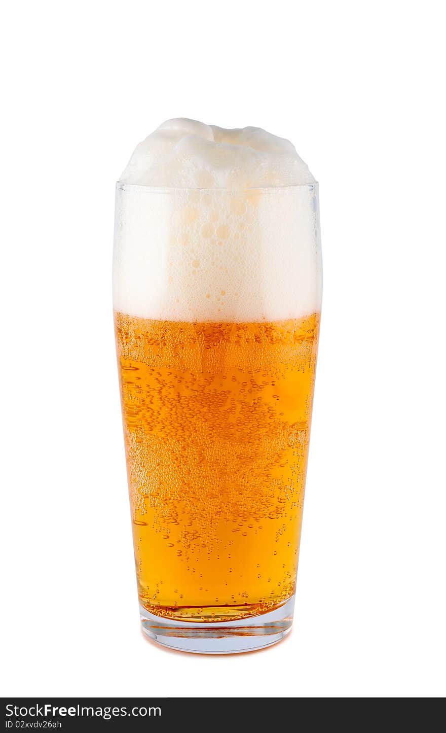 Light beer in glass isolated on white background. Clipping path. Light beer in glass isolated on white background. Clipping path.