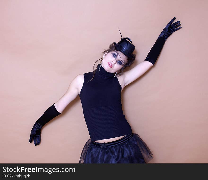 Vintage style woman wearing black hat and gloves