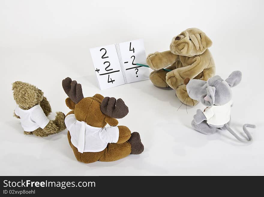 This image shows four teddy bears in math class. This image shows four teddy bears in math class