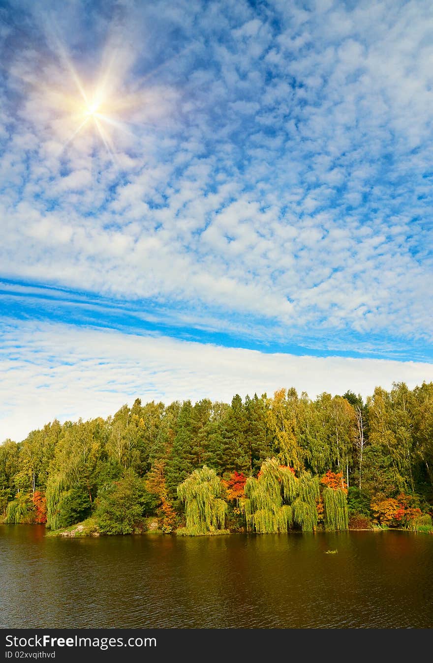 Autumnal landscape of lake and blue sky. Autumnal landscape of lake and blue sky.
