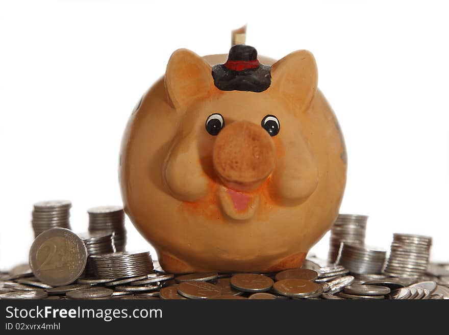 Piggy bank on coins with white background