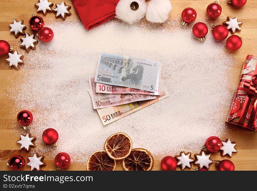 Merry christmas still life with money and some red christmas balls