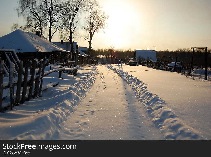 Snow road in the village