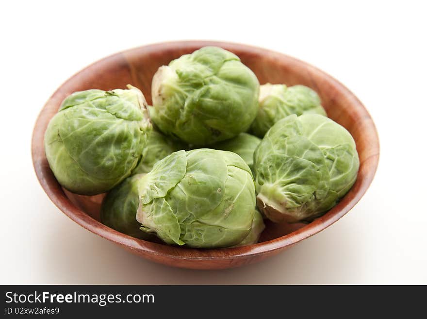 Brussels sprouts in the wood bowl. Brussels sprouts in the wood bowl