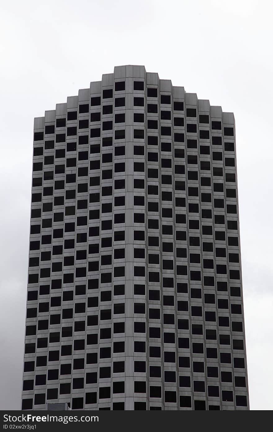 Tall modern office building with interesting shape