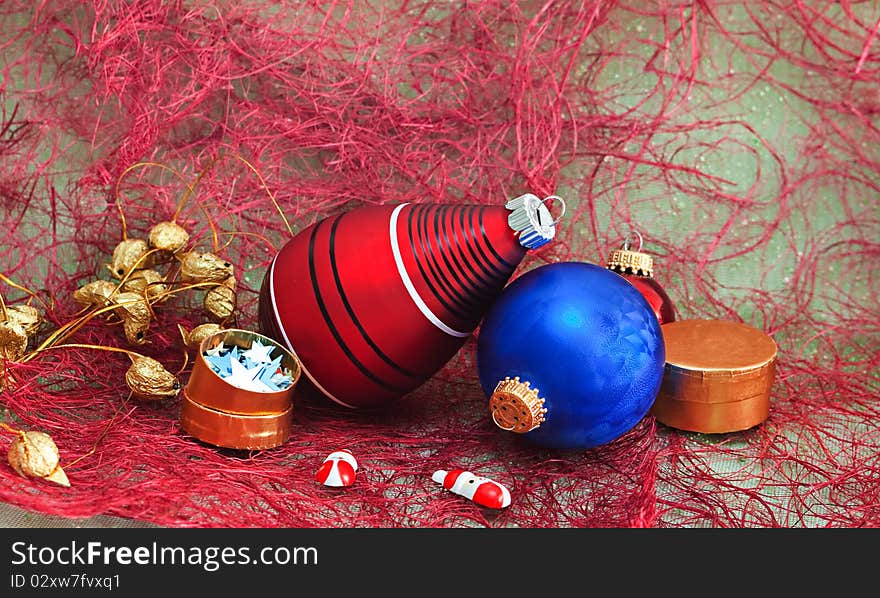 Christmas decorations with gift box on a red background. Christmas decorations with gift box on a red background.