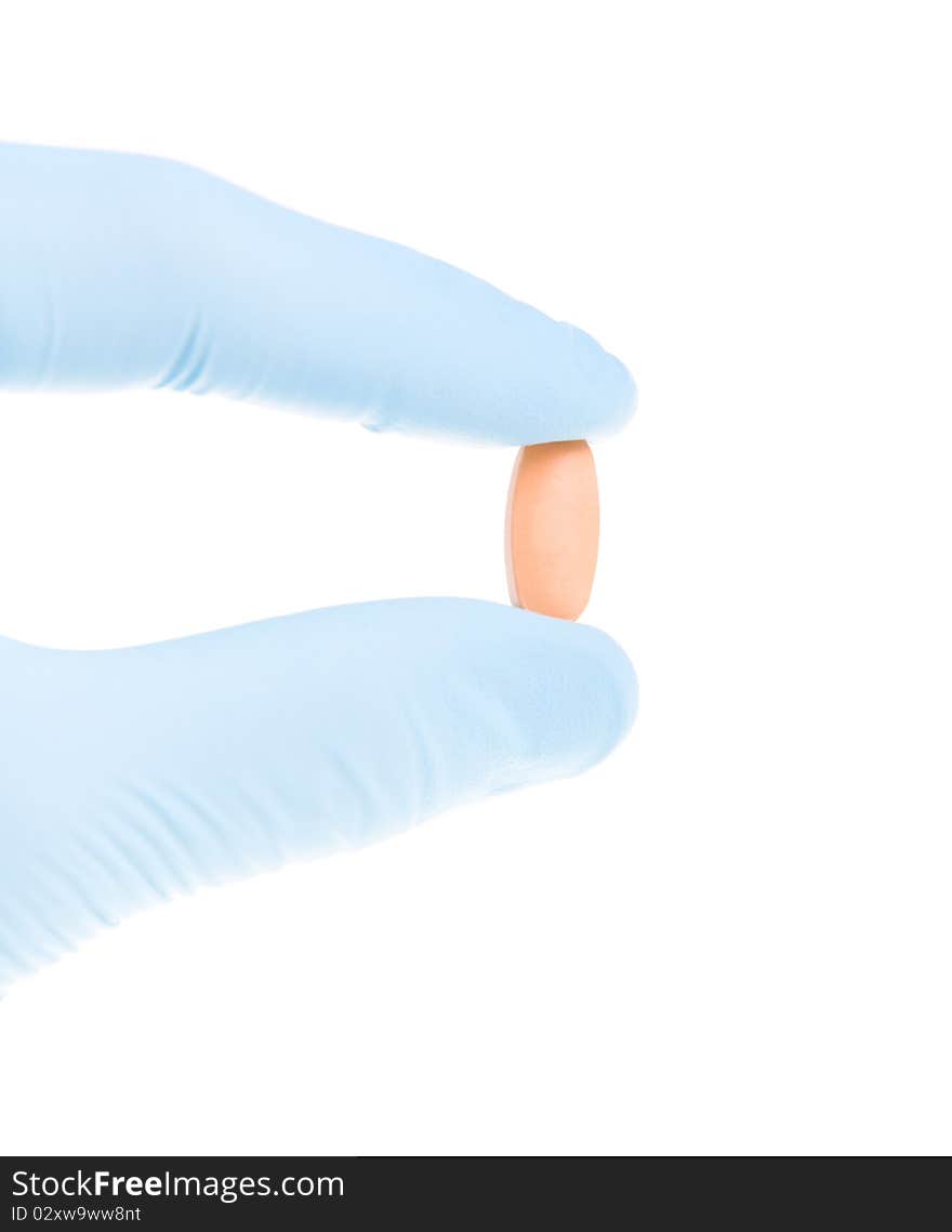 Hand holding pill doctor on a white background. Hand holding pill doctor on a white background