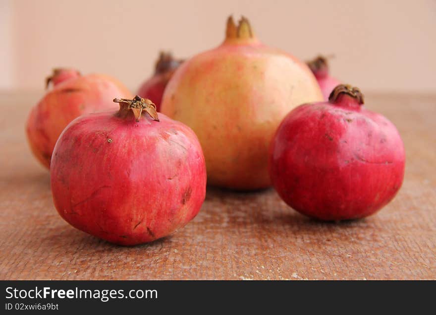 Ripe Pomegranate at wooden structure