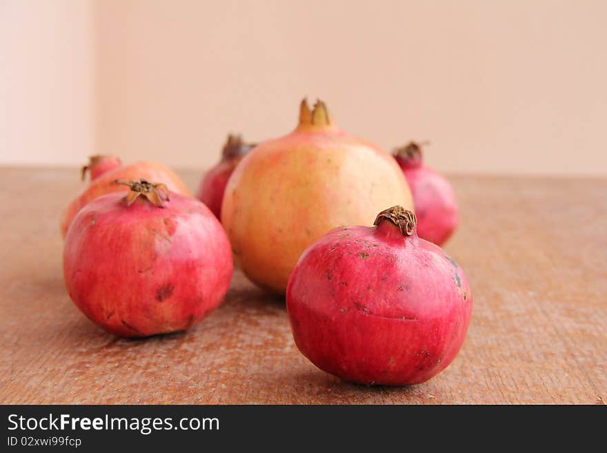 Ripe Pomegranate at wooden structure