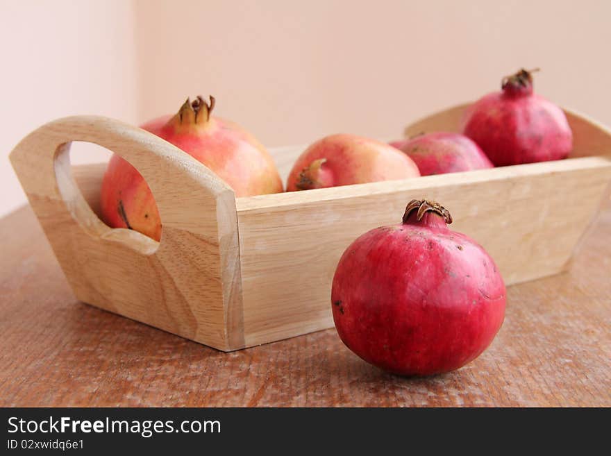 Ripe Pomegranate at wooden structure