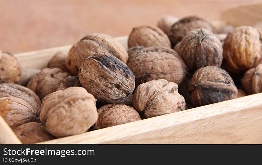 Macro view of walnut on a wooden structure