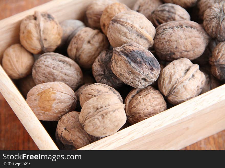 Macro view of walnut on a wooden structure