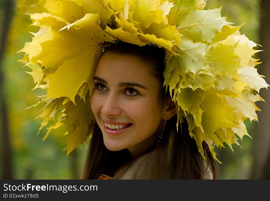 The young girl smiles in leaves. The young girl smiles in leaves