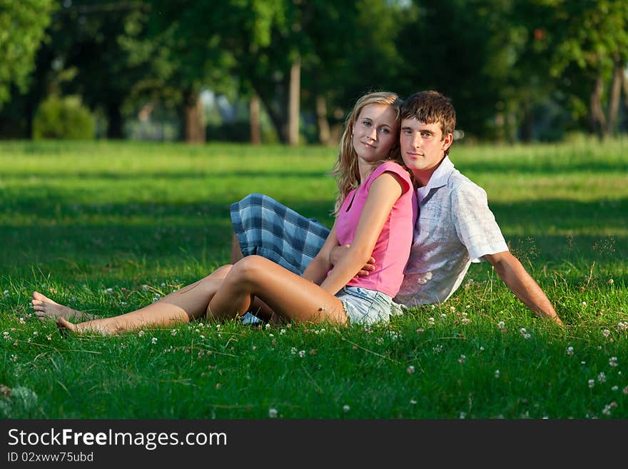 Two young lovers sitting on