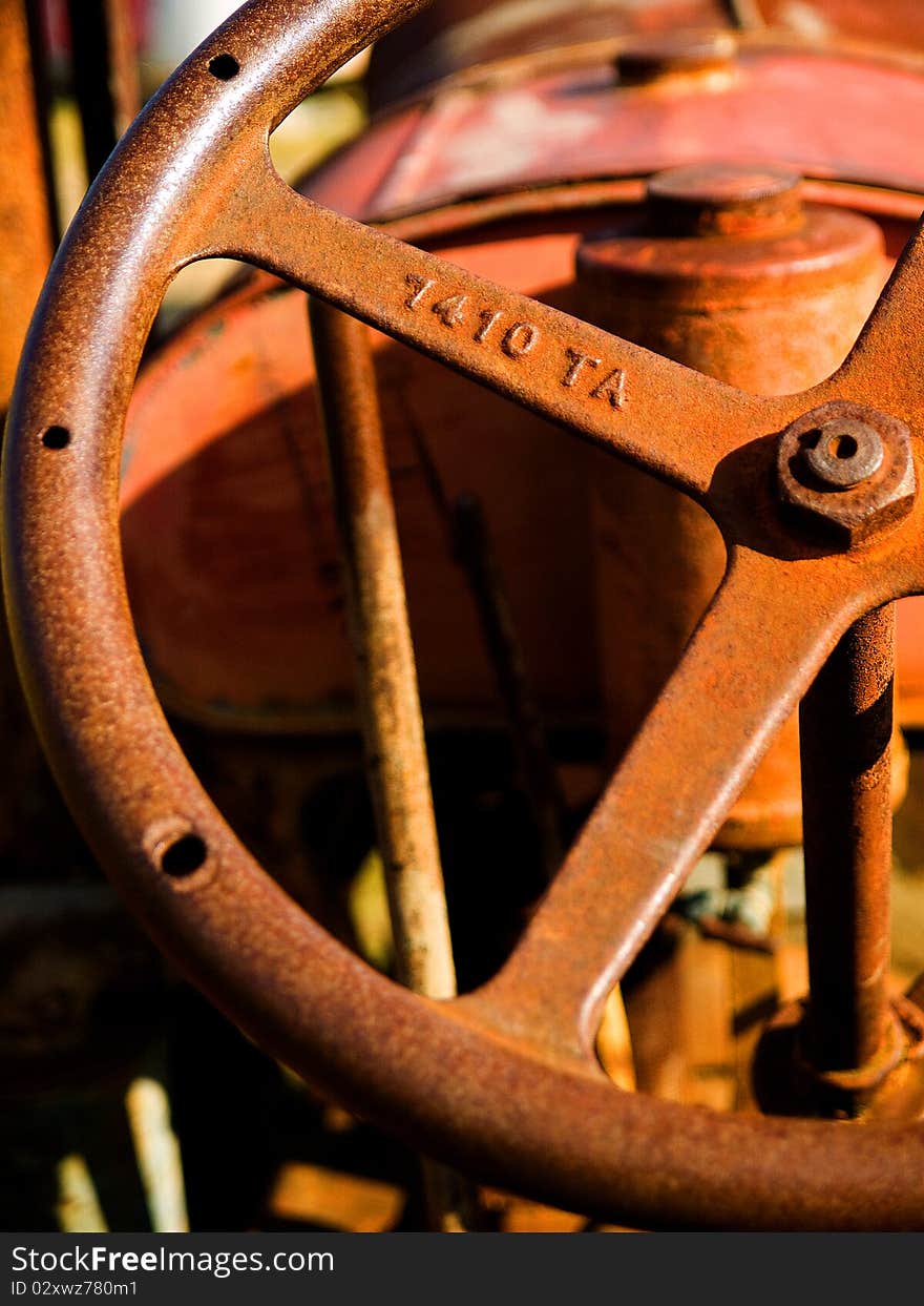 A vintage Tractor steering wheel rusted