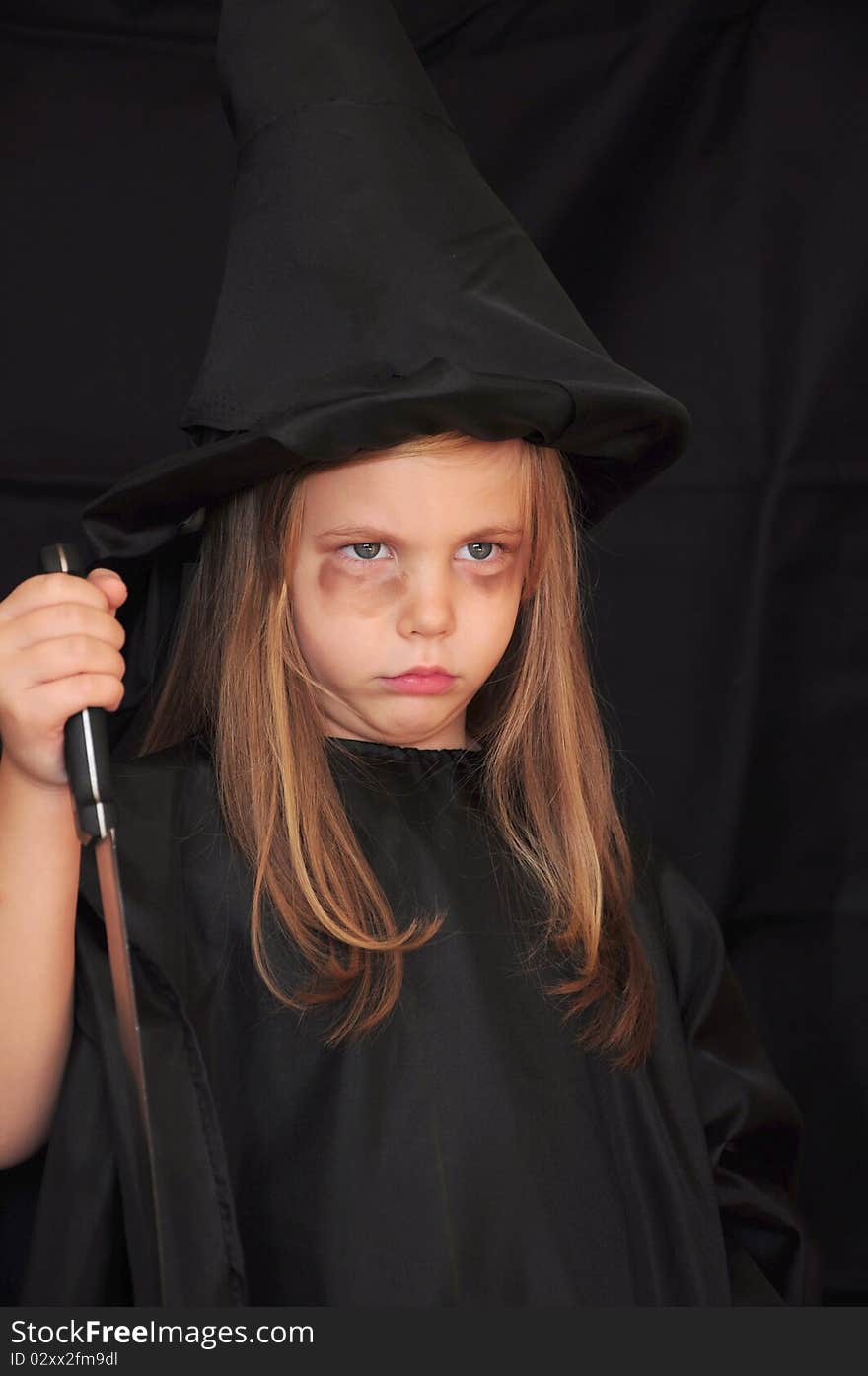 Girl Disguised As A Witch For Halloween