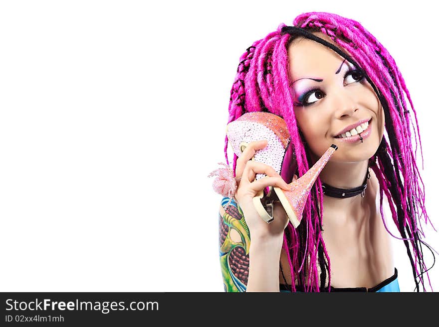 Beautiful cosplay young woman in a doll costume holding her shoes. Beautiful cosplay young woman in a doll costume holding her shoes.