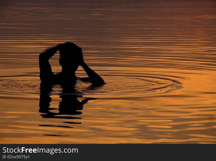 Taking a dip as the sun sets on Lake Crabtree in Raleigh, NC. Taking a dip as the sun sets on Lake Crabtree in Raleigh, NC