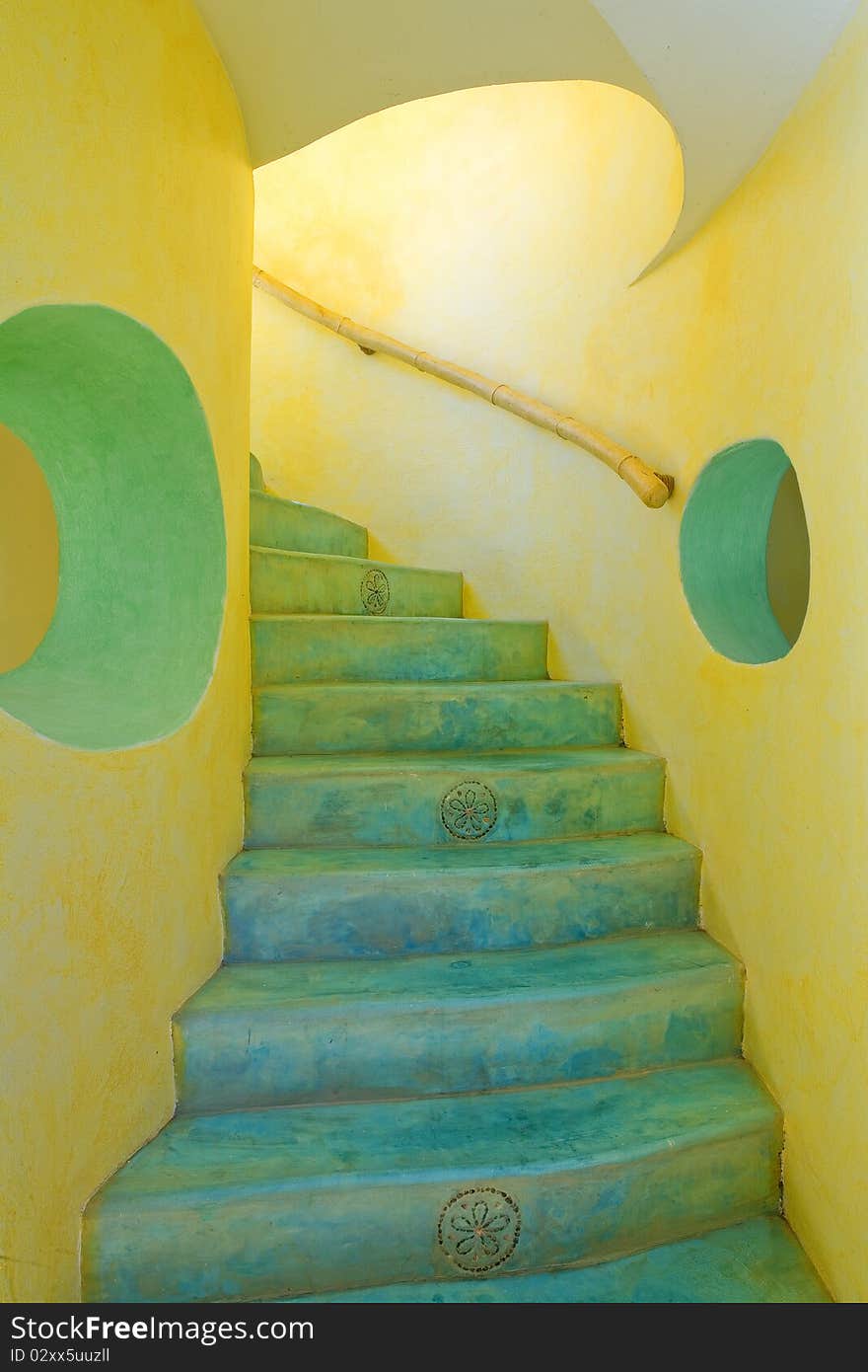 Bright yellow and blue stairway with tropical flair