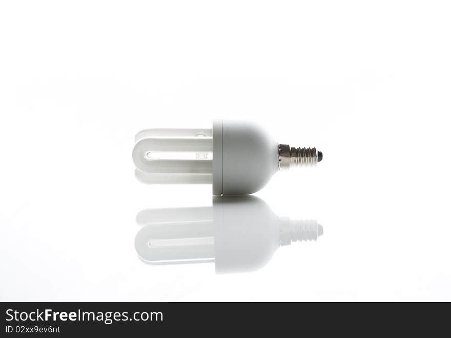 Luorscent tube on a table on a white background. Luorscent tube on a table on a white background