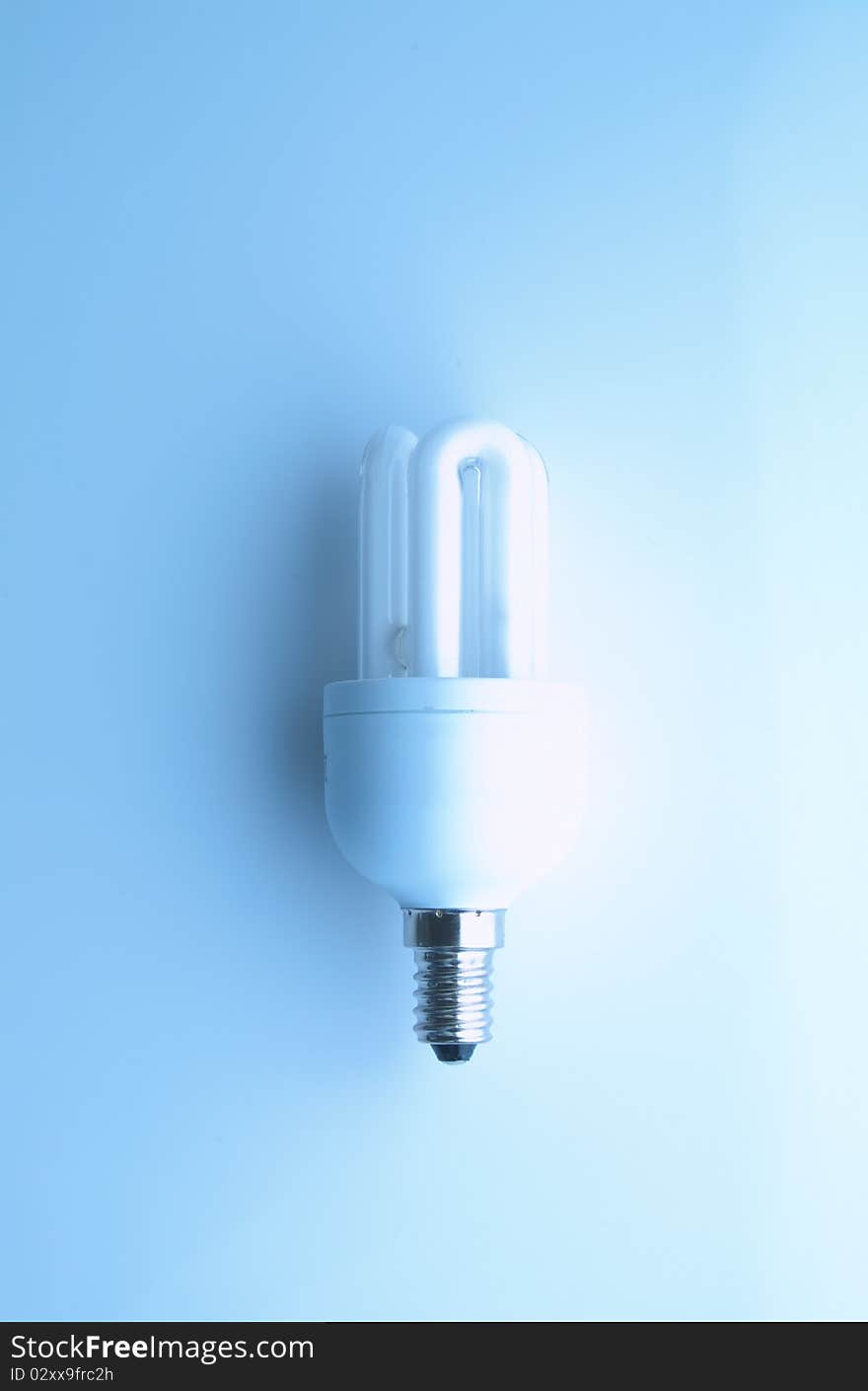 Luorscent tube on a table on a white background. Luorscent tube on a table on a white background