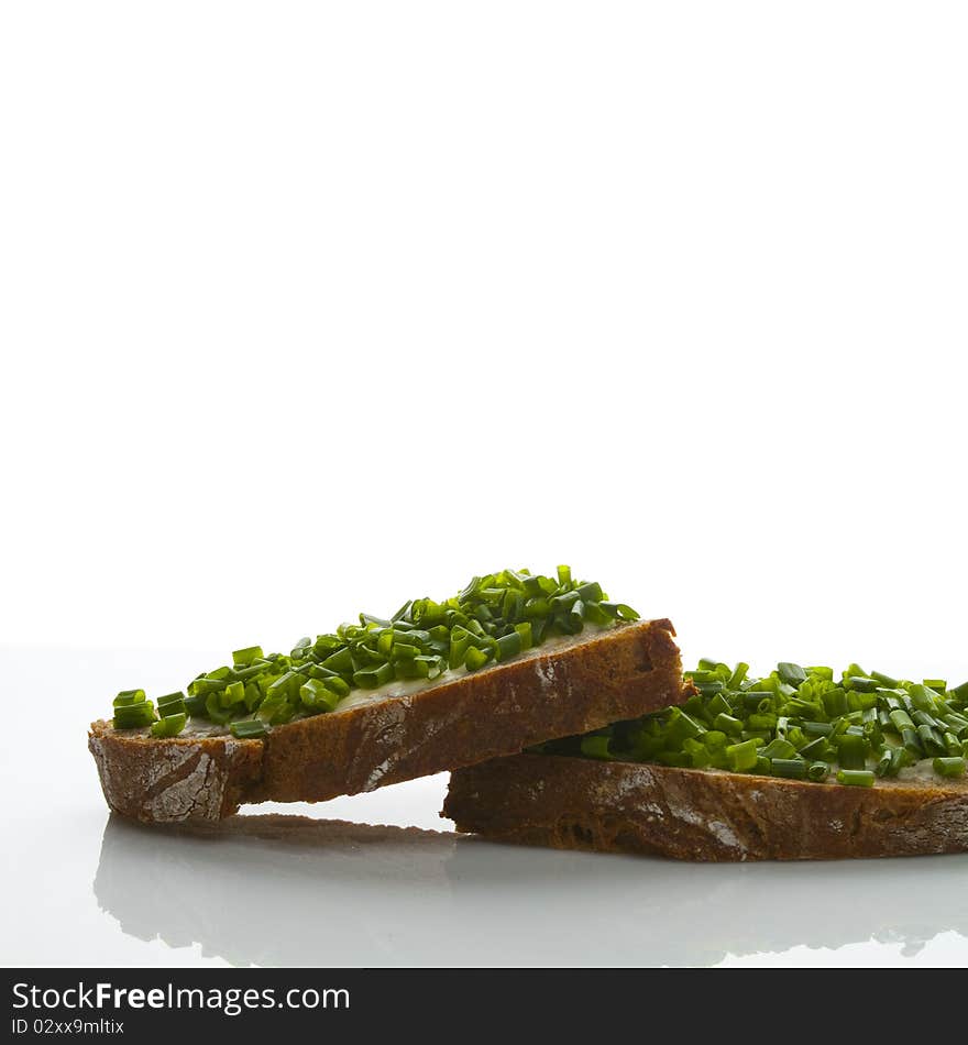 Bread butter and chives on a table