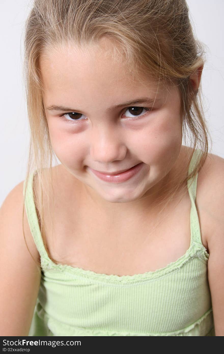 Beautiful young girl against a light background. Beautiful young girl against a light background