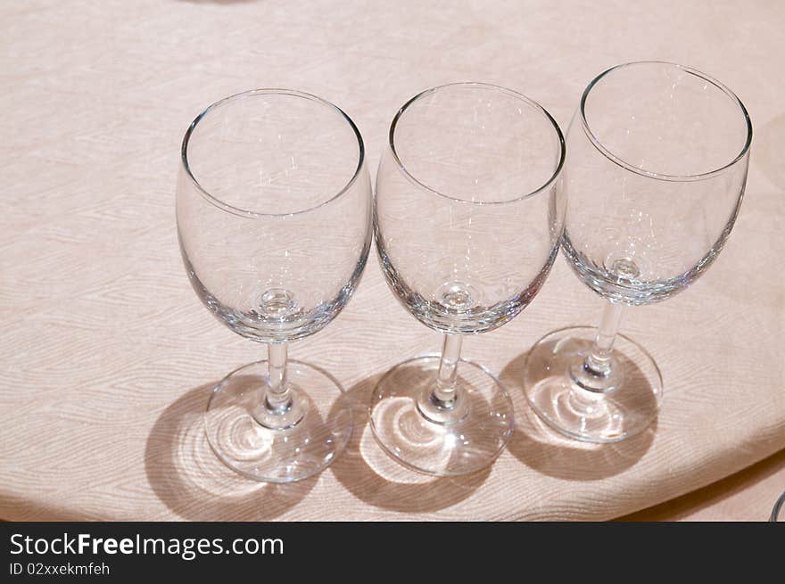 The three empty goblets under light