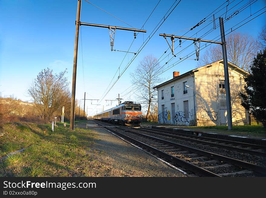 A passing train in a disused train station