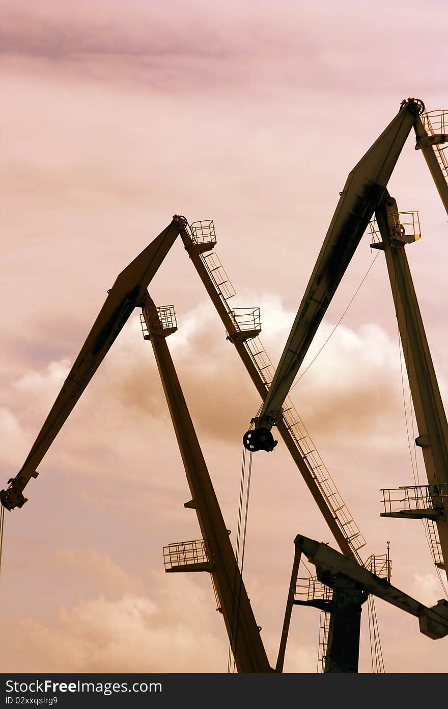 Silhouette of port cranes