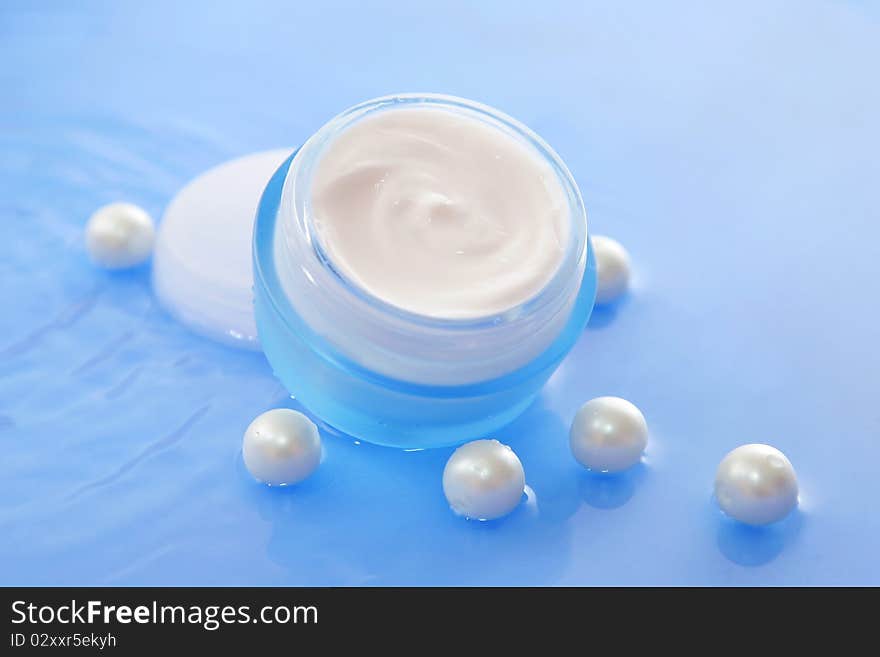 Luxury jar of cream with perls in water