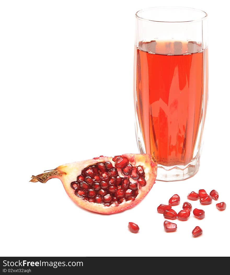 Pomegranate juice in a glass isolated on a white background.