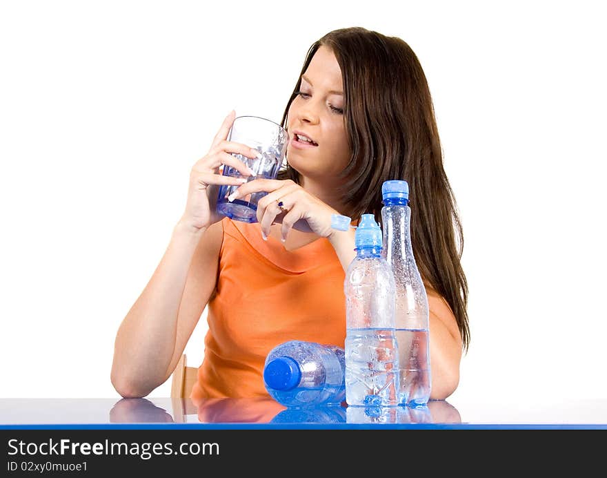 Woman drinking healthy mineral water.Demonstration of healthy nutrition. Woman drinking healthy mineral water.Demonstration of healthy nutrition