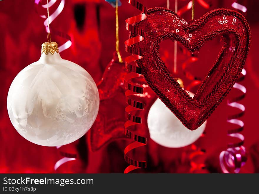 Christmas baubles and ribbons on red background. Christmas baubles and ribbons on red background