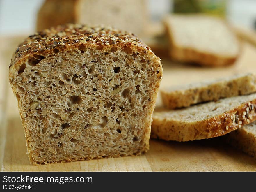 Sliced bread with grains on the board