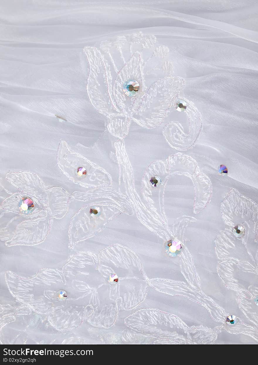 Embroidered fabric part of wedding dress. Embroidered fabric part of wedding dress